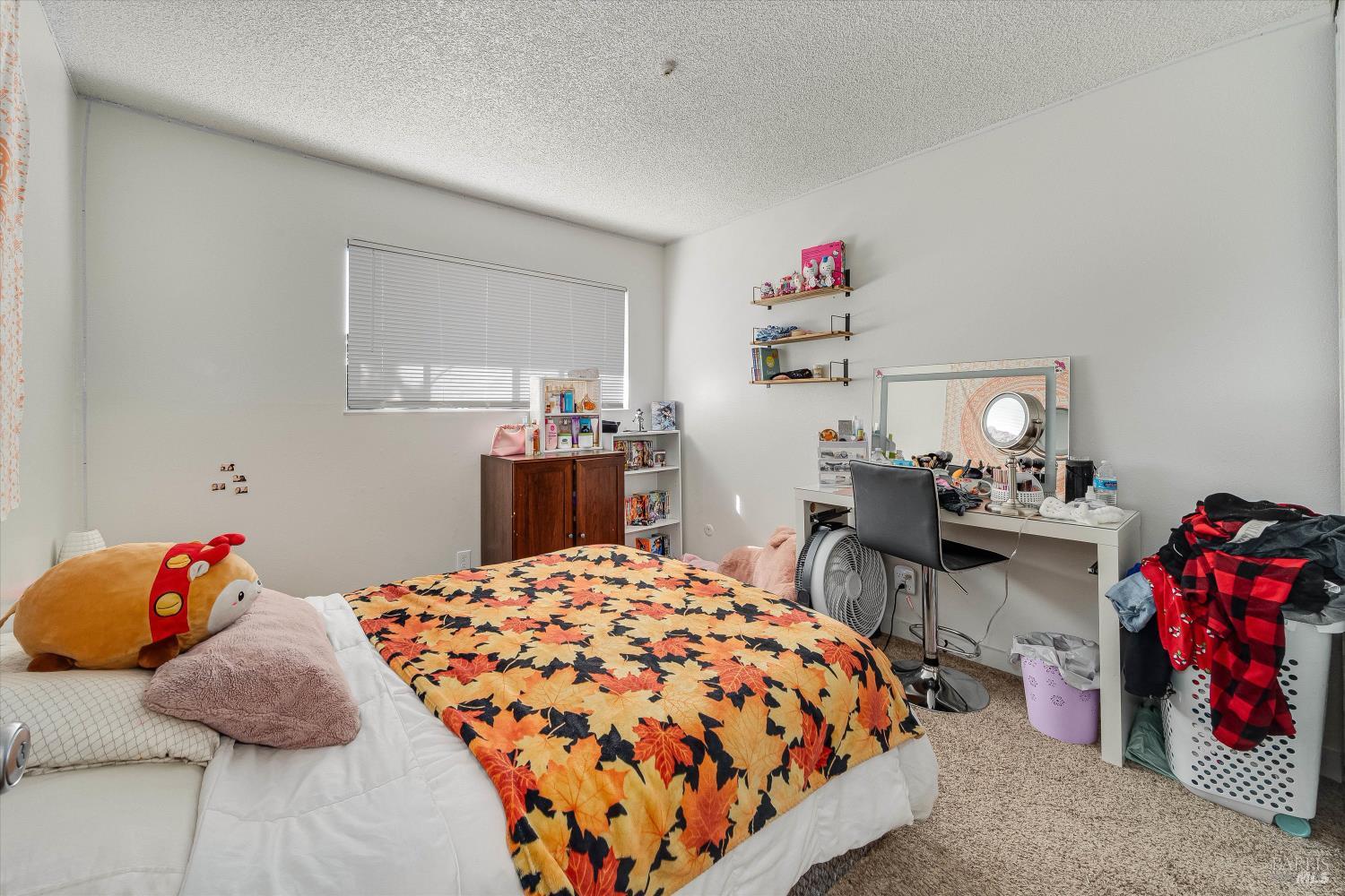 220-226 Arlen Drive Rohnert Park, CA 94928 - Photo 49 of 56 a bedroom with a bed and dresser