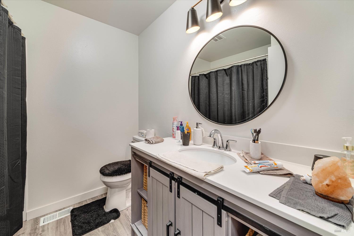 220-226 Arlen Drive Rohnert Park, CA 94928 - Photo 52 of 56 a bathroom with a sink and a mirror
