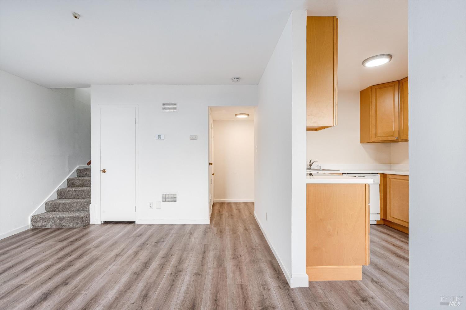 220-226 Arlen Drive Rohnert Park, CA 94928 - Photo 6 of 56 a view of a room with wooden floor and staircase