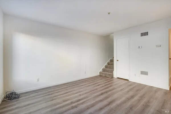 a view of a storage & utility room with wooden floor