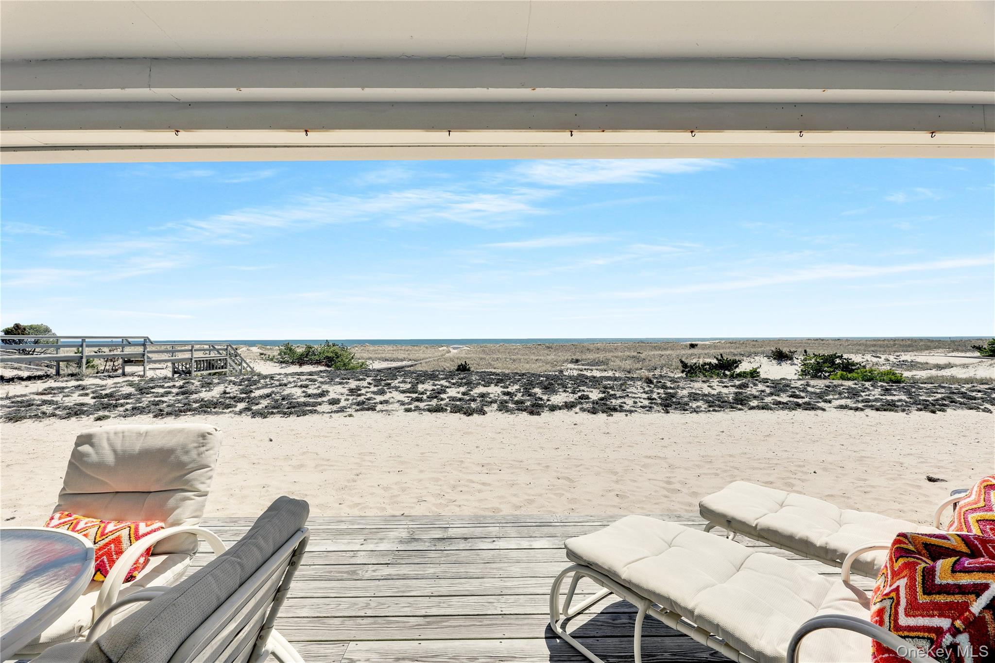 279 Dune Road, Unit 2 Westhampton Beach, NY 11978 - Photo 5 of 45 a view of a swimming pool and an outdoor seating