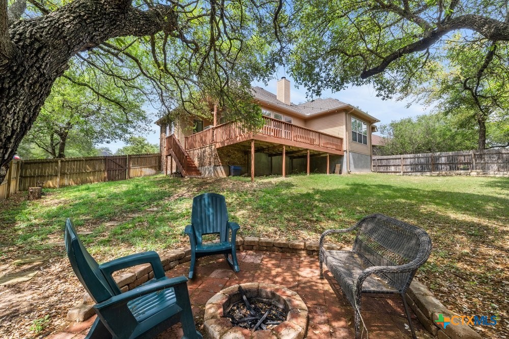 2402 Twin Ridge Court Belton, TX 76513 - Photo 36 of 42 Backyard firepit towards back deck