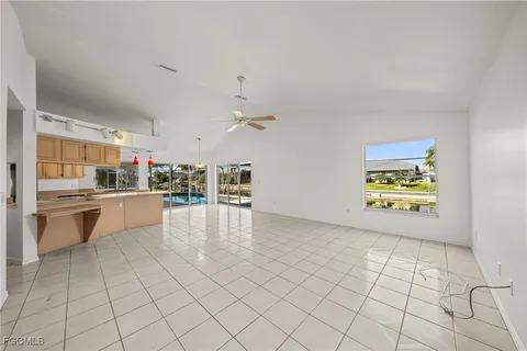 a view of a kitchen with a sink and a stove top oven