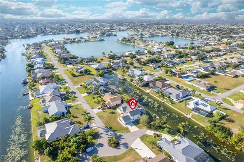 an aerial view of residential building and lake