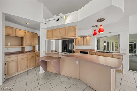 a room with lots of table and chairs