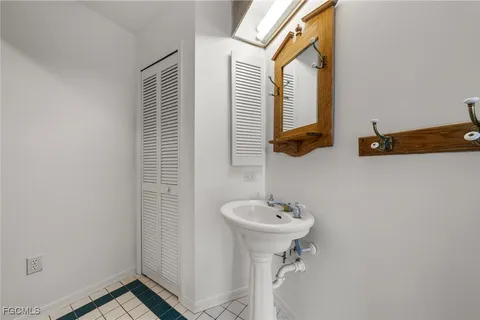 a kitchen with white cabinets