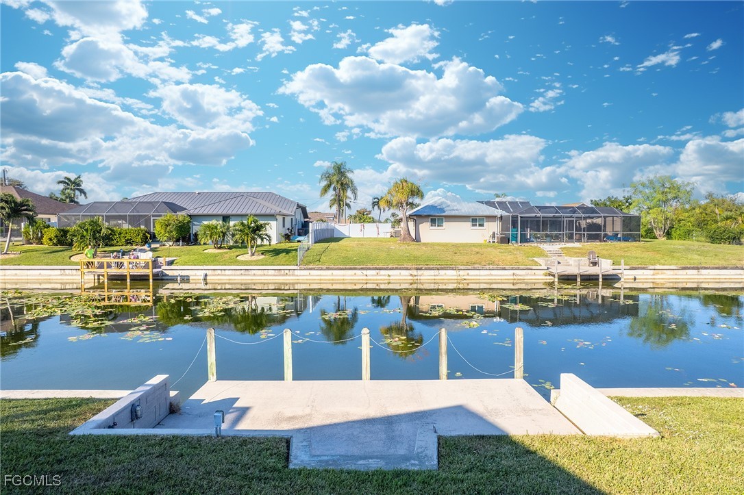 1225 Southeast 3rd Street Cape Coral, FL 33990 - Photo 40 of 48 a view of a swimming pool with an outdoor seating