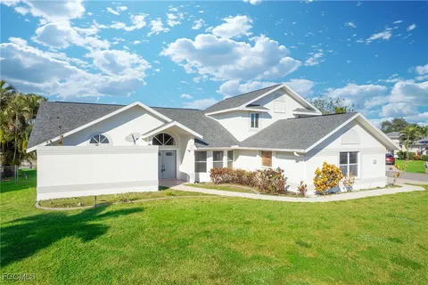 a front view of house with yard and green space