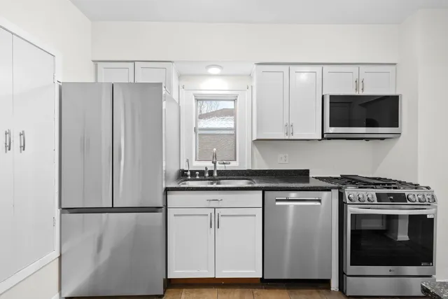 a view of a big room with windows and bathroom