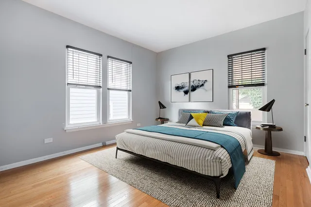 a kitchen with stainless steel appliances white cabinets and a refrigerator