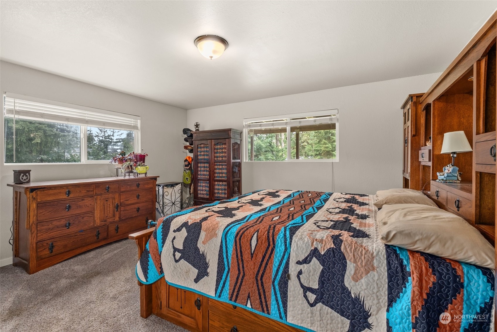 10104 Albany Place Southwest Rochester, WA 98579 - Photo 17 of 31 a bedroom with a bed and window
