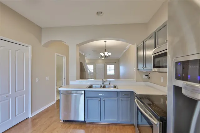 a bathroom with a granite countertop double vanity sink and a mirror
