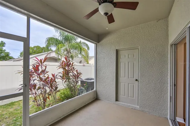 a view of a livingroom with furniture and a window