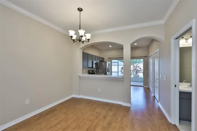 a view of a kitchen from the hallway