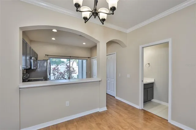 a view of a room with window and cabinet