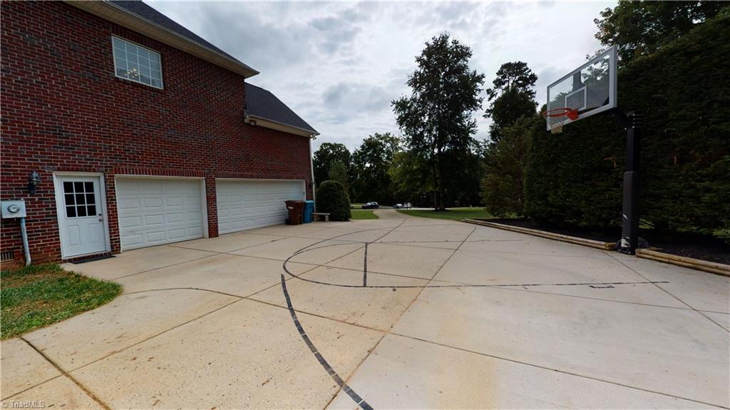 2610 Oxmoor Road Summerfield, NC 27358 - Photo 25 of 31 Extra large driveway with permanent basketball goal