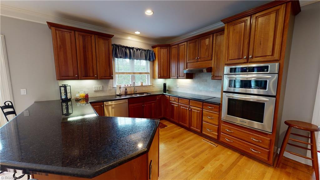 2610 Oxmoor Road Summerfield, NC 27358 - Photo 6 of 31 Stainless Oven/Microwave; Smooth Cooktop