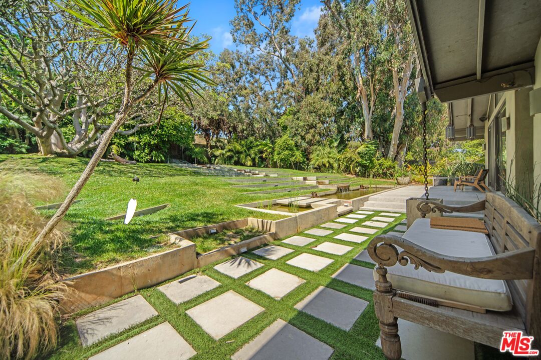 31226 Bailard Road Malibu, CA 90265 - Photo 11 of 40 a view of backyard with swimming pool and outdoor seating