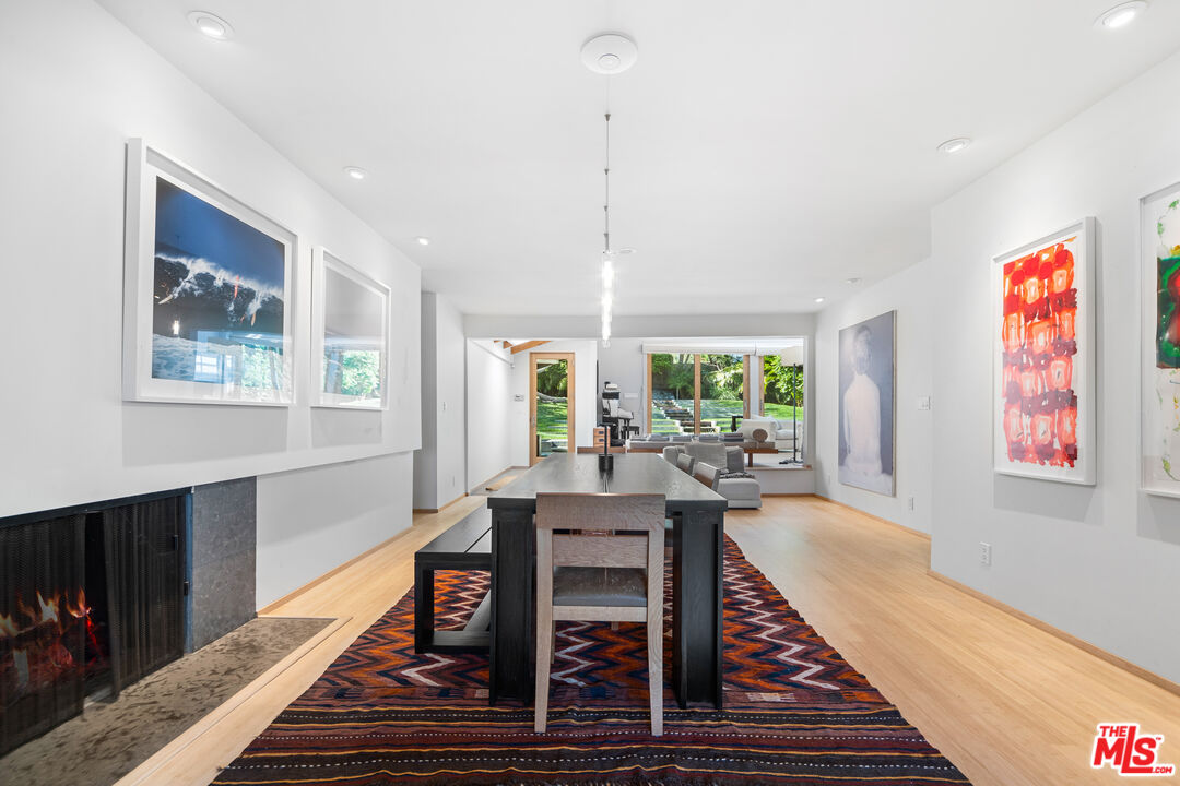31226 Bailard Road Malibu, CA 90265 - Photo 13 of 40 a view of a dining room with furniture window and wooden floor