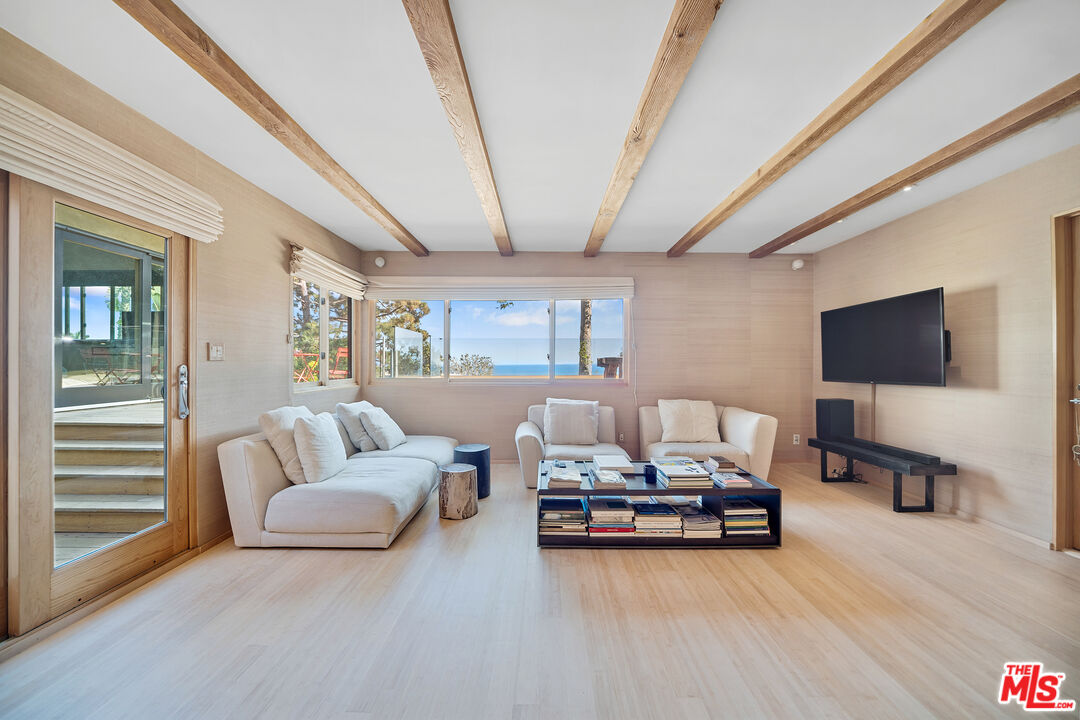 31226 Bailard Road Malibu, CA 90265 - Photo 15 of 40 a living room with furniture and a flat screen tv