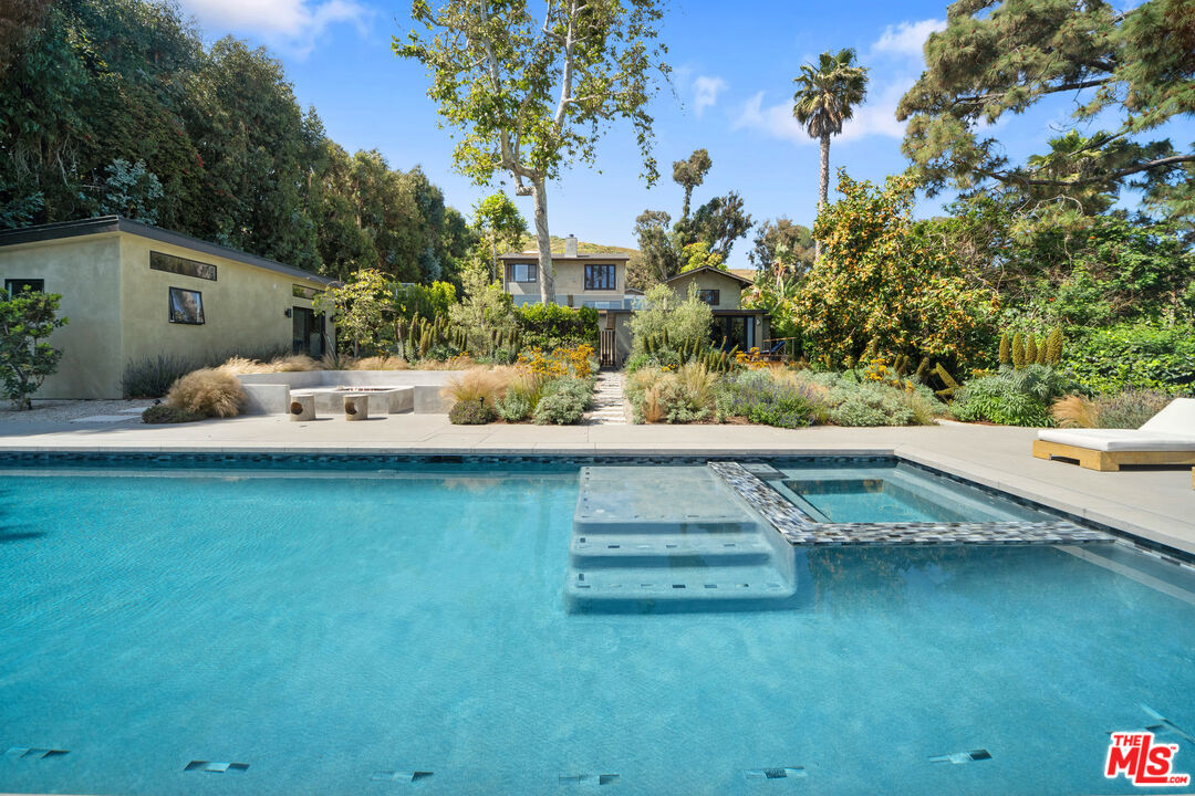 31226 Bailard Road Malibu, CA 90265 - Photo 18 of 40 a view of a house with a yard porch and sitting area