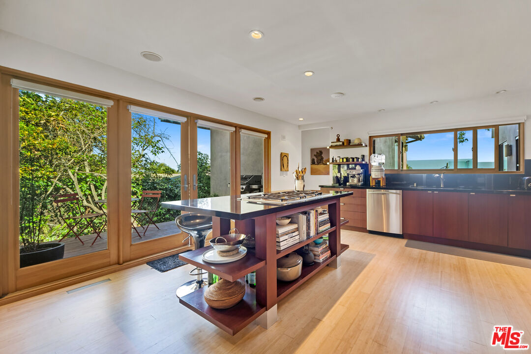 31226 Bailard Road Malibu, CA 90265 - Photo 24 of 40 a living room with furniture and a wooden floor