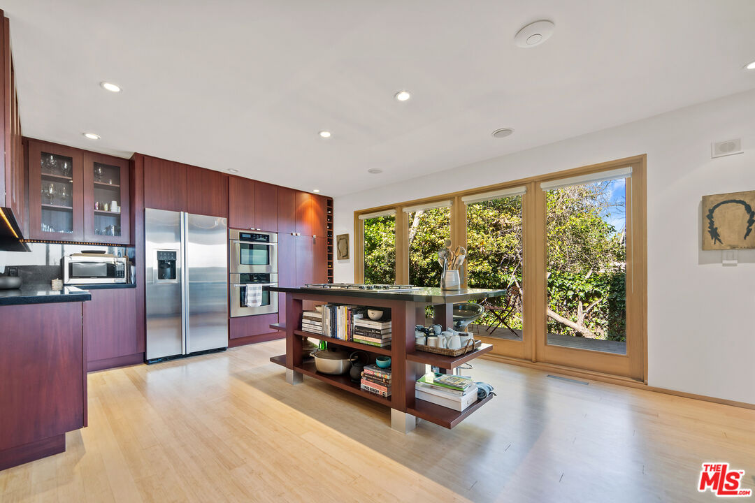 31226 Bailard Road Malibu, CA 90265 - Photo 25 of 40 a living room with furniture and large windows