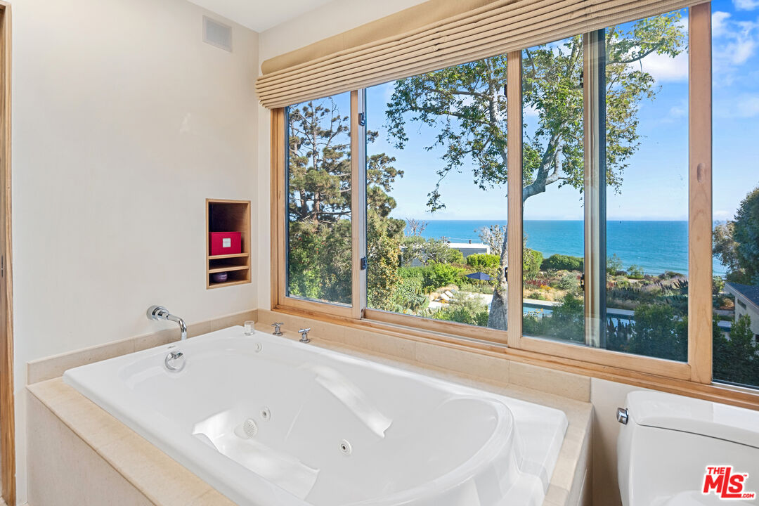 31226 Bailard Road Malibu, CA 90265 - Photo 30 of 40 a white bath tub sitting in front of a window
