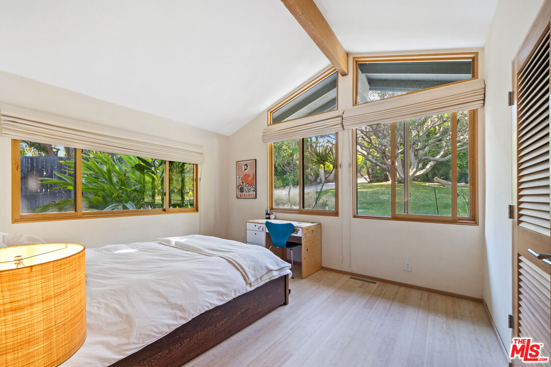 31226 Bailard Road Malibu, CA 90265 - Photo 31 of 40 a bed sitting in a bedroom next to a window
