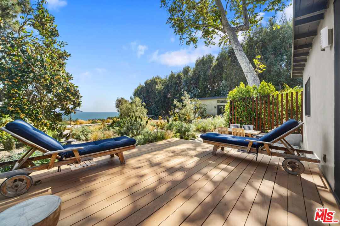 31226 Bailard Road Malibu, CA 90265 - Photo 34 of 40 a view of a backyard with couches chair and wooden floor