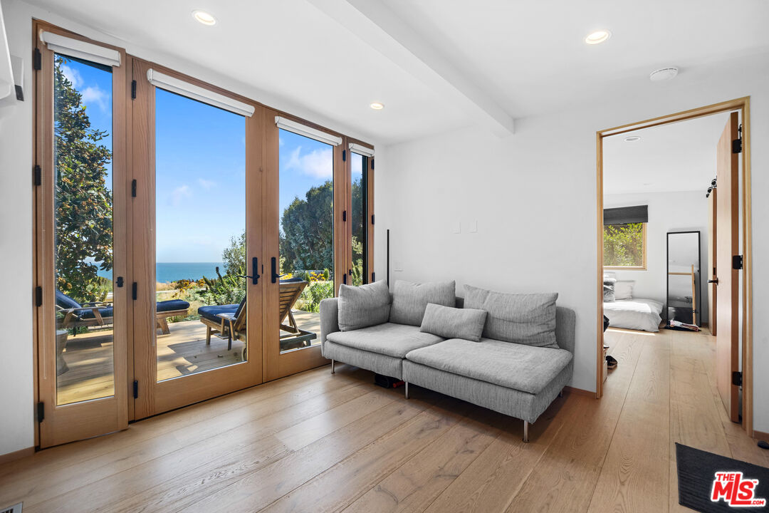 31226 Bailard Road Malibu, CA 90265 - Photo 36 of 40 a living room with furniture and large windows
