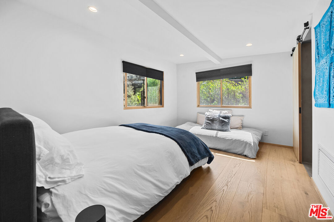 31226 Bailard Road Malibu, CA 90265 - Photo 37 of 40 a bedroom with a bed and a couch