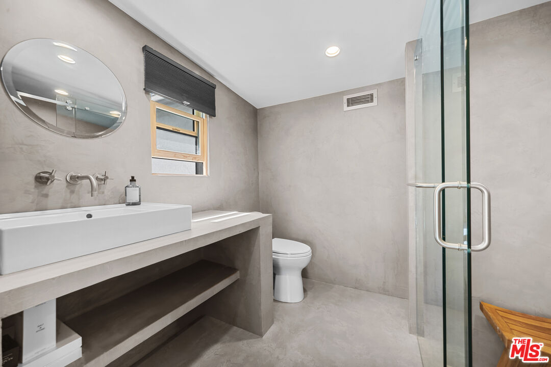 31226 Bailard Road Malibu, CA 90265 - Photo 38 of 40 a bathroom with a toilet sink and mirror