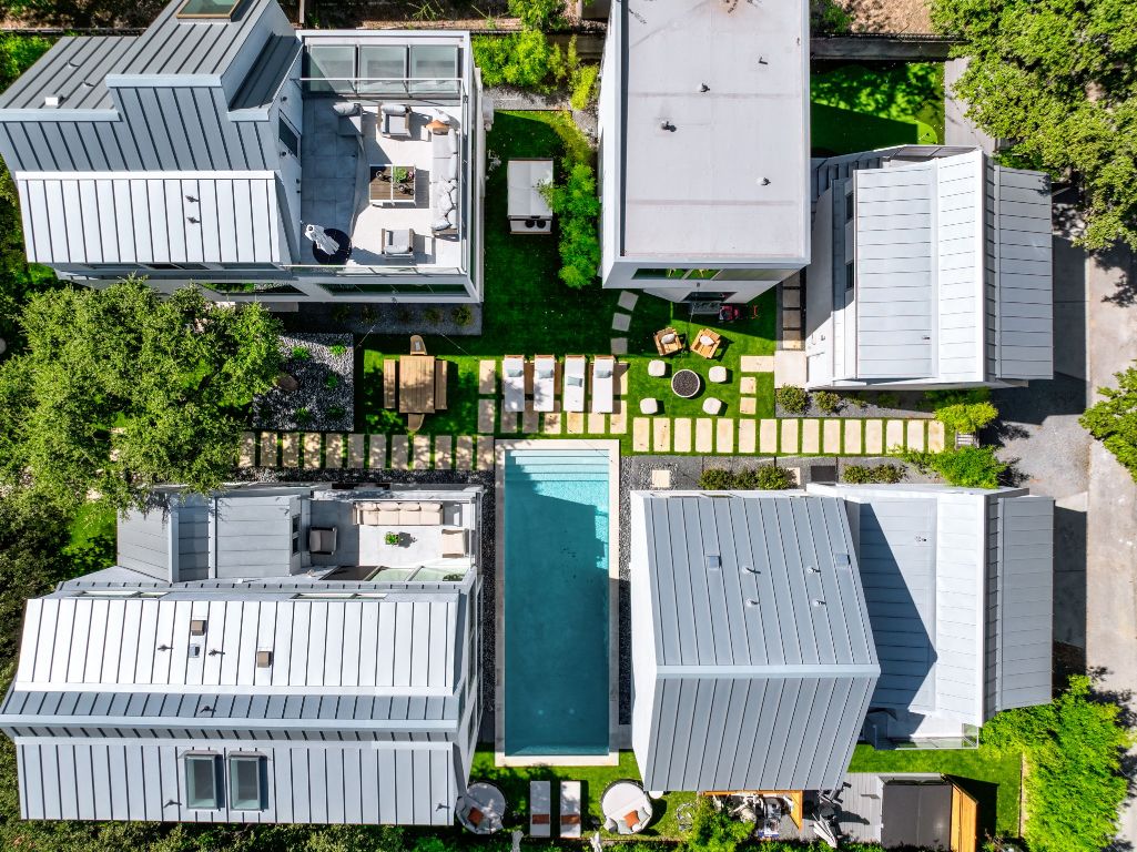 a view of a house with wooden fence