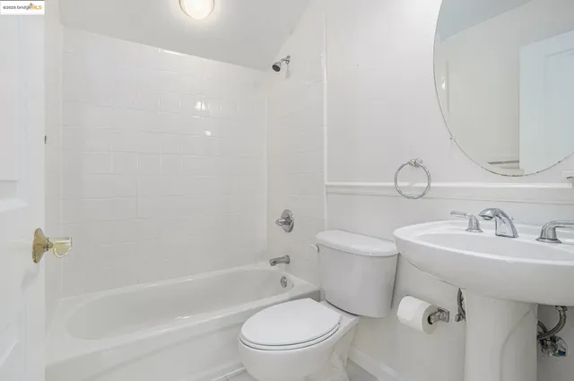 a bathroom with a toilet a sink and a bathtub