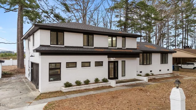 a front view of a house with yard