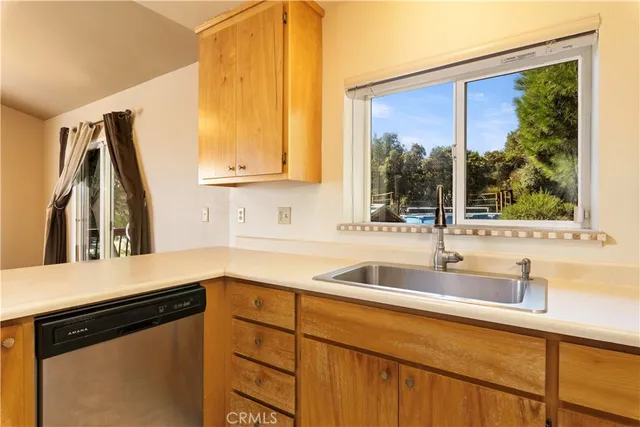 a stove top oven sitting inside of a kitchen