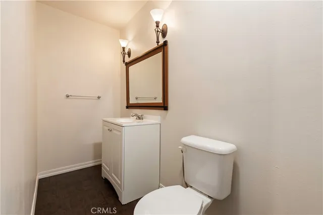 a view of a house with pool and sitting area