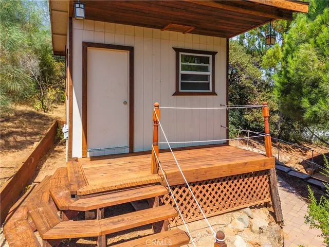 an aerial view of a house with swimming pool and garden