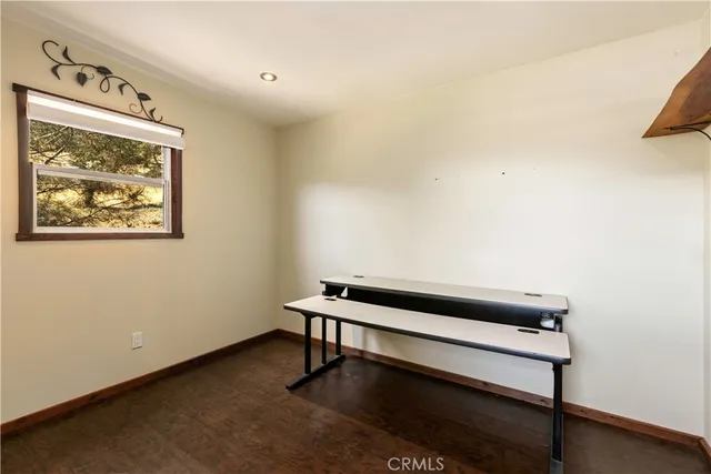 an aerial view of a house with a yard and garden