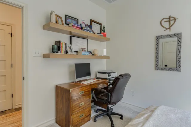 a workspace with furniture and window