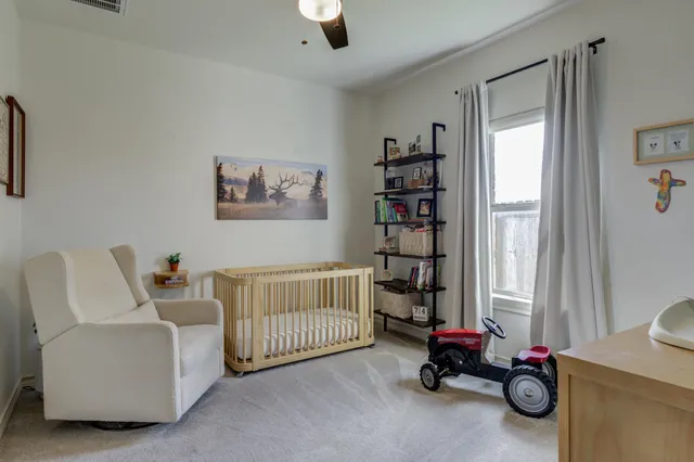a bedroom with furniture and a window
