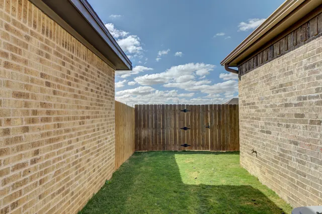 a view of backyard with sitting area