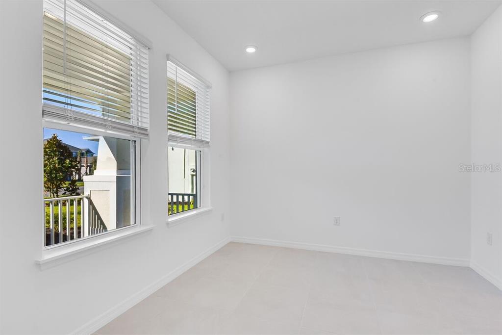 581 Moon Shell Circle New Smyrna Beach, FL 32168 - Photo 11 of 40 a view of an empty room with a window