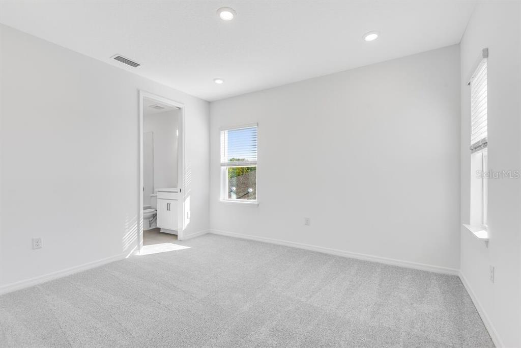 581 Moon Shell Circle New Smyrna Beach, FL 32168 - Photo 22 of 40 an empty room with windows