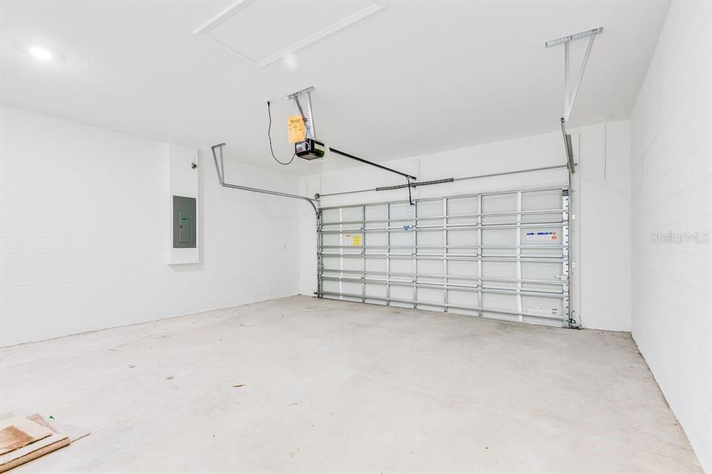 581 Moon Shell Circle New Smyrna Beach, FL 32168 - Photo 33 of 40 a view of a garage with stairs