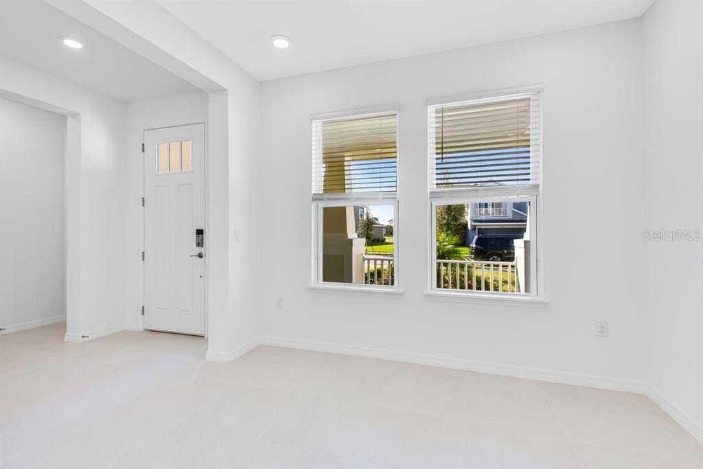 581 Moon Shell Circle New Smyrna Beach, FL 32168 - Photo 10 of 40 an empty room with windows