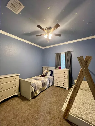 a bed room with bed and window