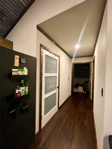 a bathroom with a toilet and a mirror