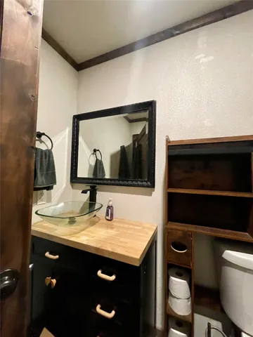 a bedroom with a bed and a mirror